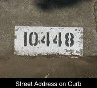 Street address on curb